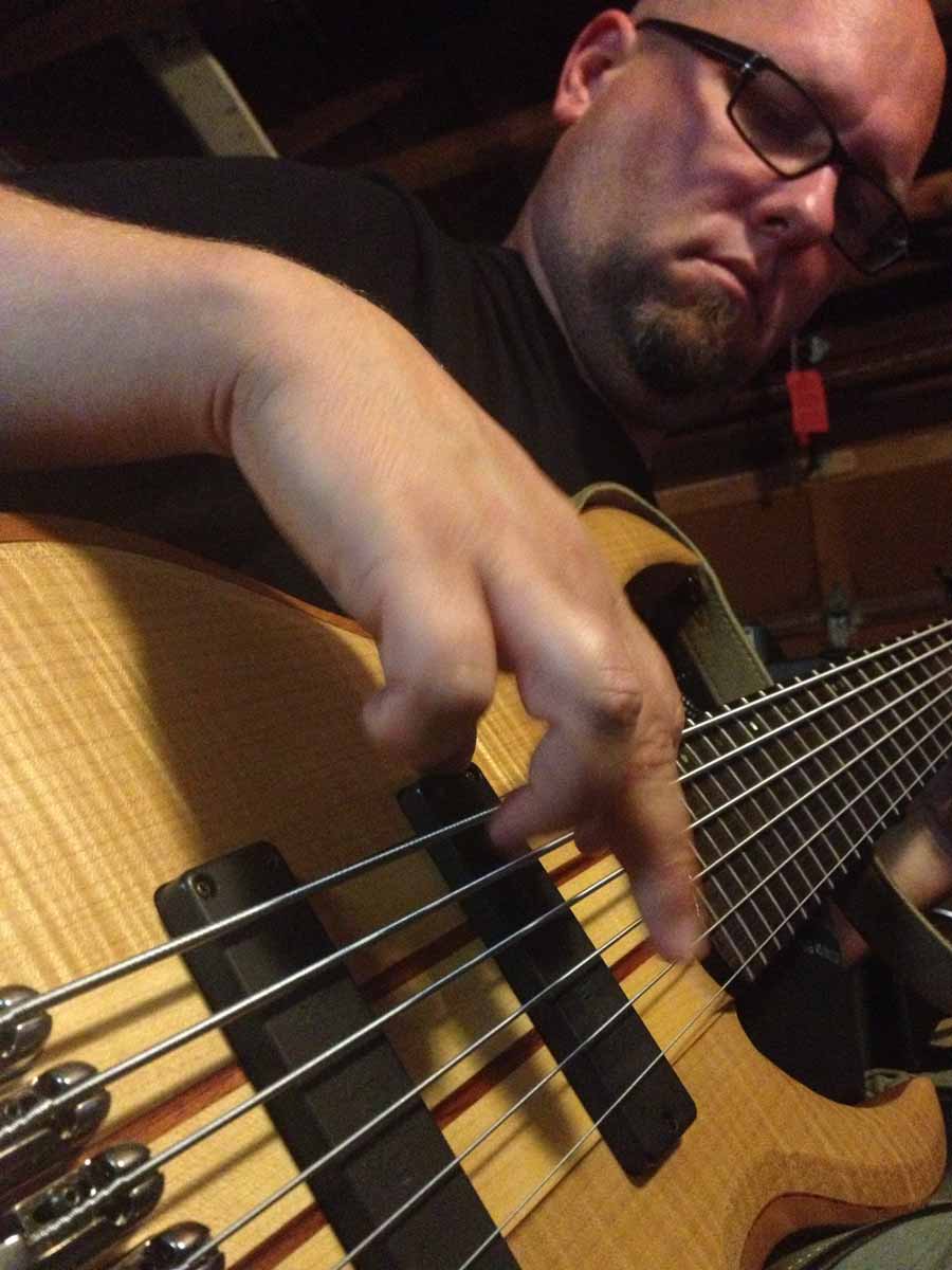 Travis playing 6-string bass